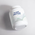 Container of Plant Protein by Rejuvrx on a light gray background