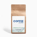 Kraft paper coffee bag with REJUVRX label on a white background