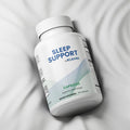 Sleep support supplement bottle labeled 'Rejuvrx' on a light gray background