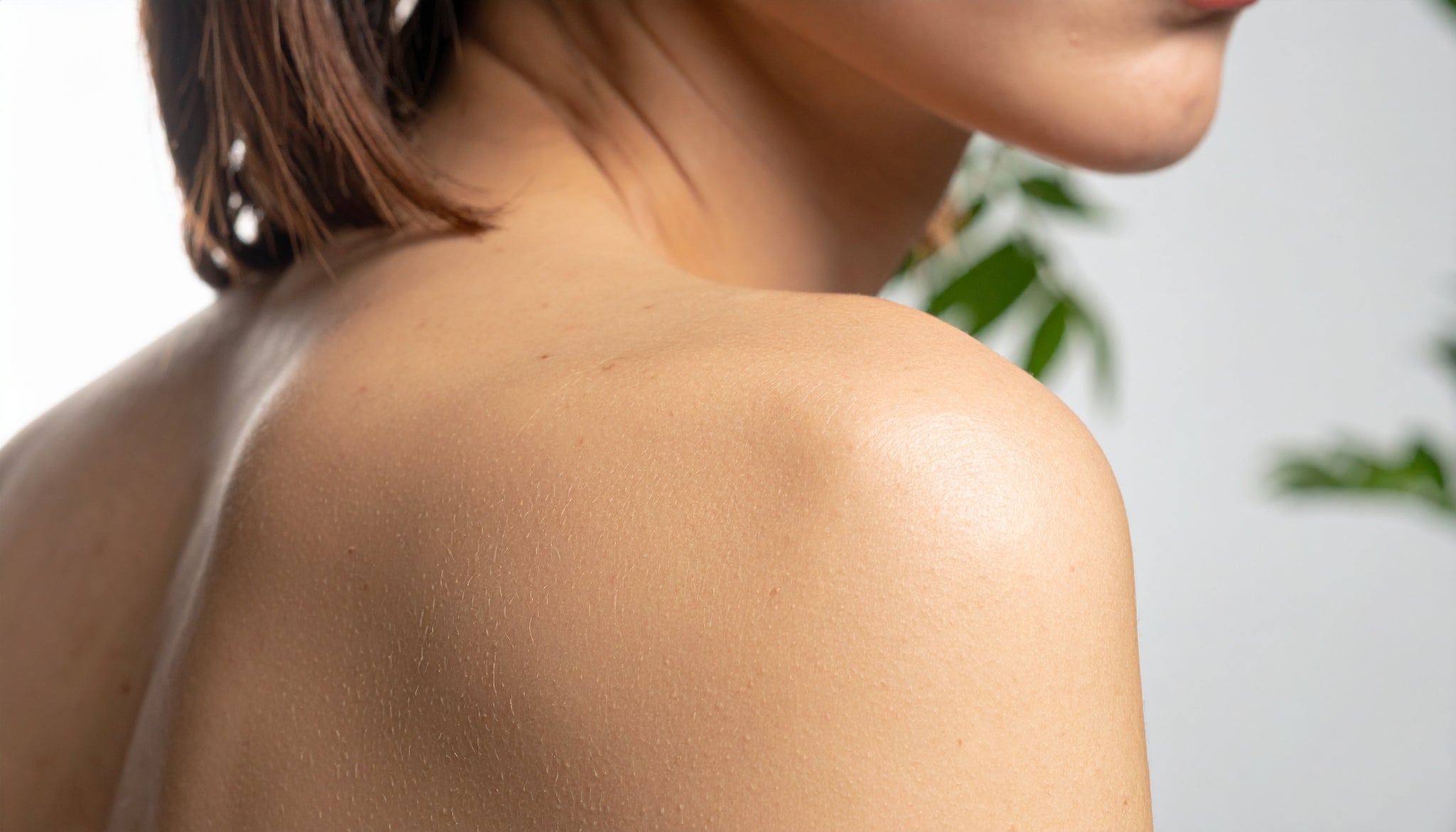 Close up of a womans should in a softly lighted setting